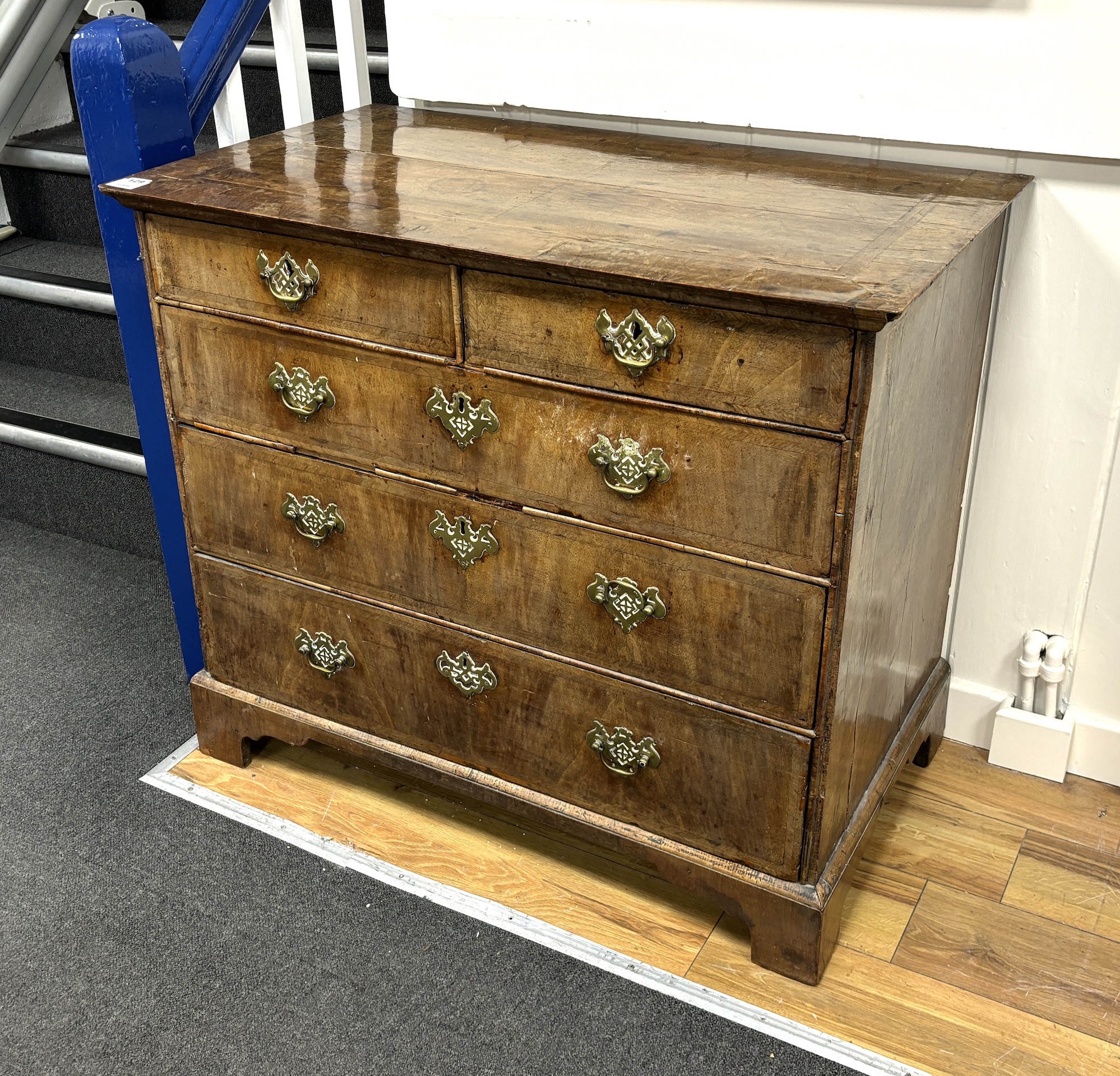 An 18th century feather banded walnut chest of two short and three long drawers, width 96cm, depth 55cm, height 82cm
